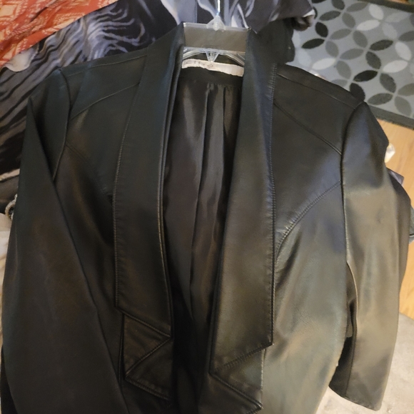 Faux leather jacket.  With material on arms. Very cute - Picture 8 of 12